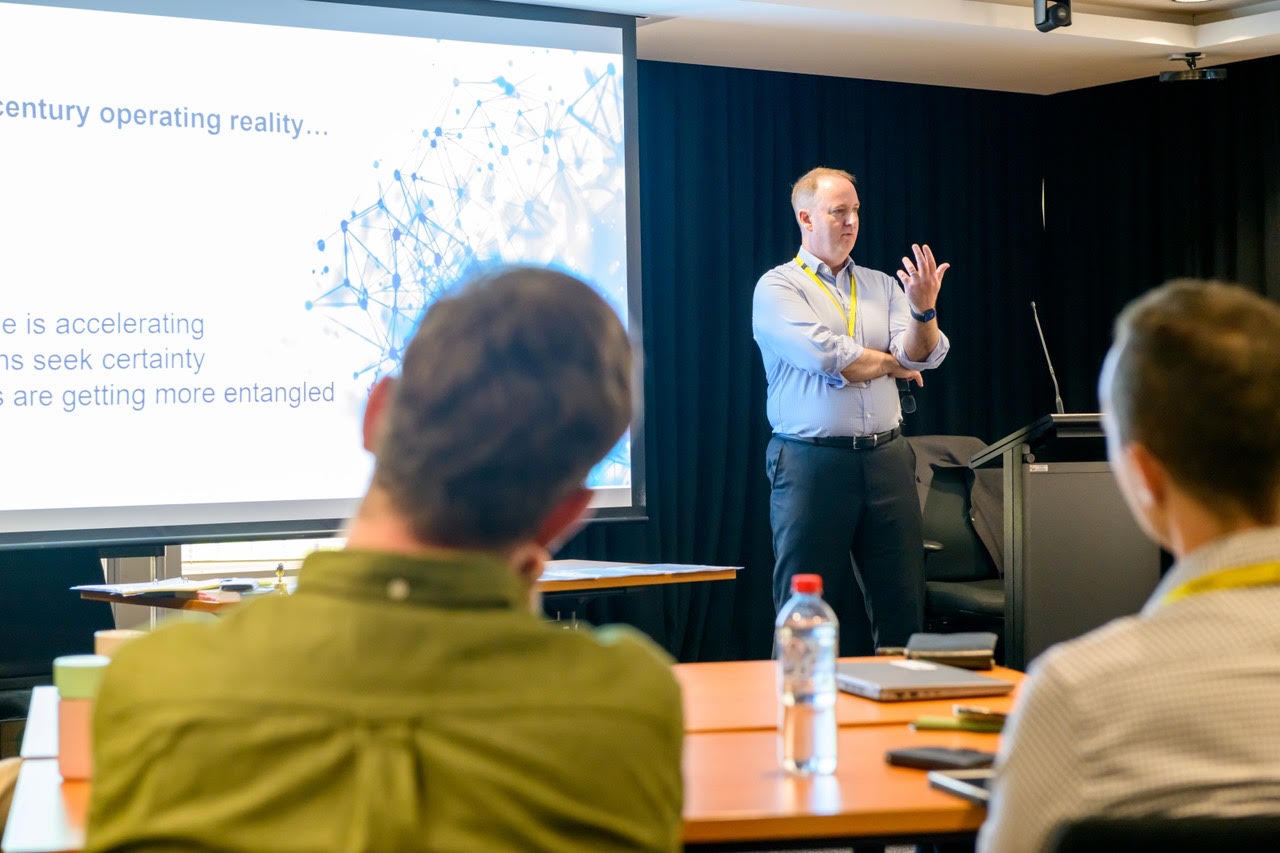 Rob Warner facilitating a working session with regulatory practitioners.